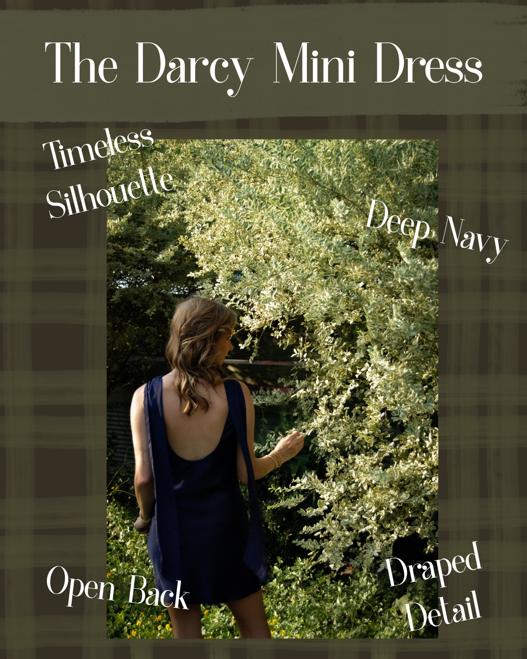 A promotional graphic for 'The Darcy Mini Dress' showing a woman from behind wearing a deep navy blue dress in an outdoor garden setting. The image features text overlays highlighting key features like 'Timeless Silhouette', 'Deep Navy', 'Open Back', and 'Draped Detail' against a dark olive-brown plaid border.